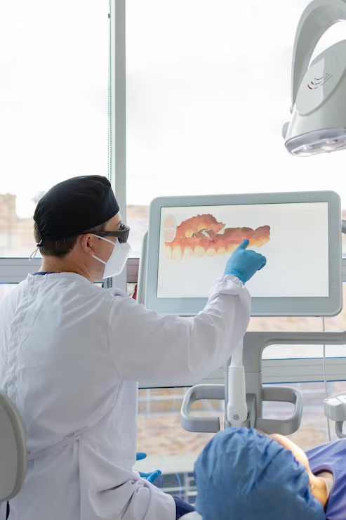 Dentist reviewing a digital intraoral scan on a chairside screen